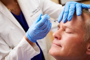 Man Having Botox Treatment At Beauty Clinic